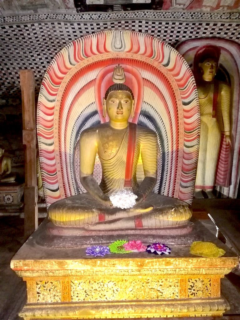 Dambulla Caves colourful Buddha statue